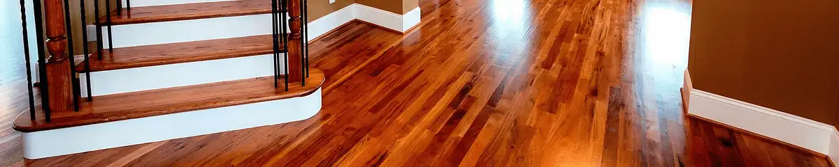 Base floor of a staircase with professionally restored wood flooring in Boston MA