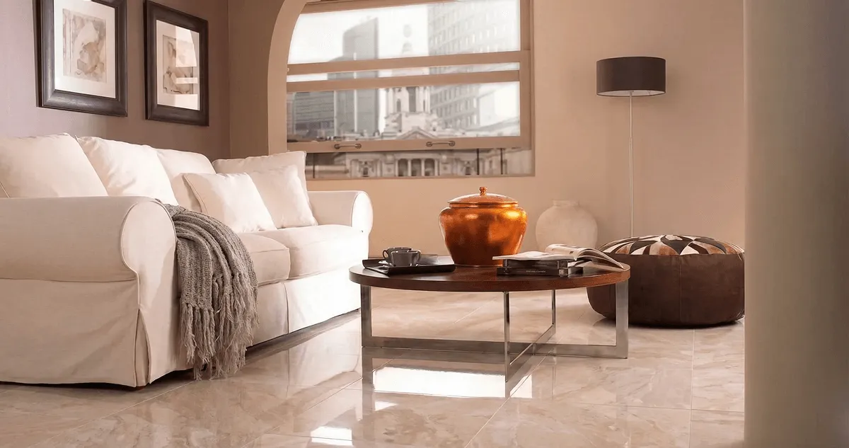Modern living room with professionally installed marble flooring, a beige sofa, coffee table in Boston, MA