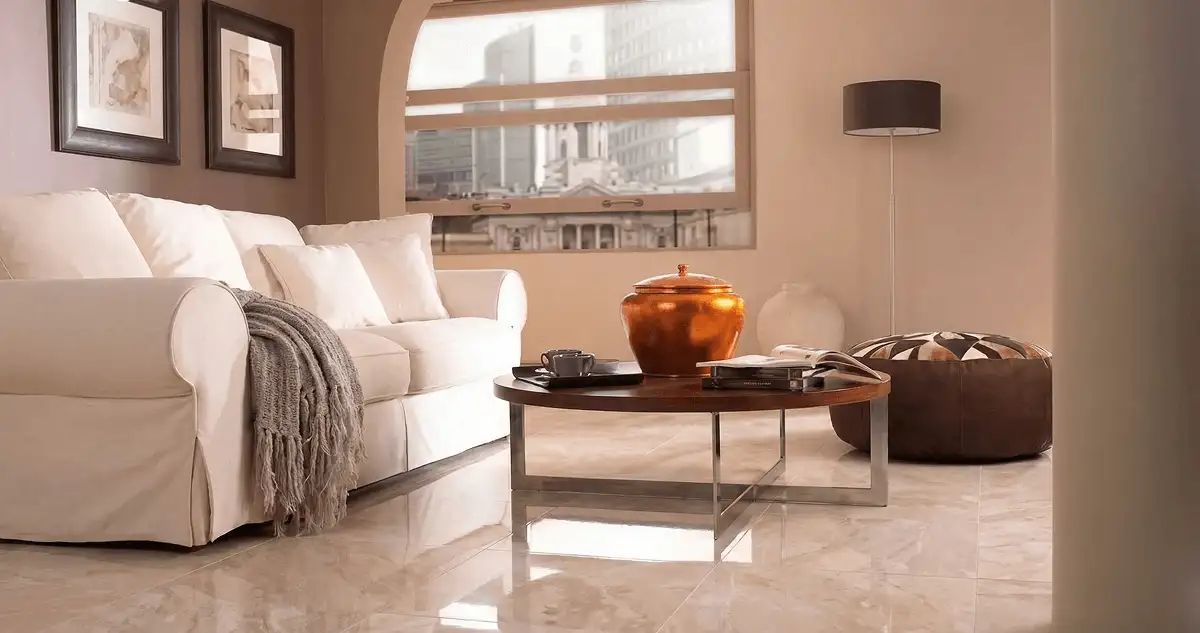 Modern living room with professionally installed marble flooring, a beige sofa, coffee table in Boston, MA