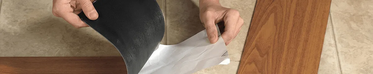A professional installing vinyl flooring in Boston, MA