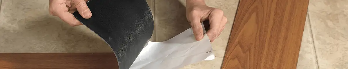 A professional installing vinyl flooring in Boston, MA